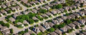 Aerial view of suburban neighborhood with houses and trees