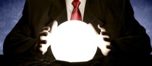 Person in suit holding glowing crystal ball